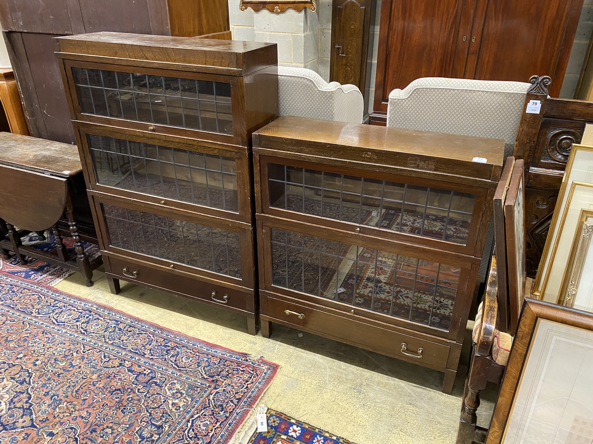 Two Globe Wernicke oak three and two sectional bookcases, larger width 87cm, depth 29cm, height 128cm